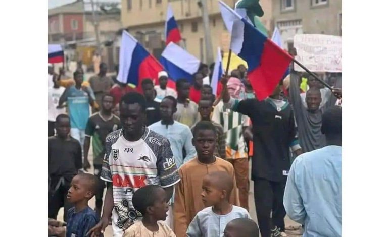 #EndBadGovernance: Confusion As Kano Protesters Fly Russian Flag, Call For Putin Intervention